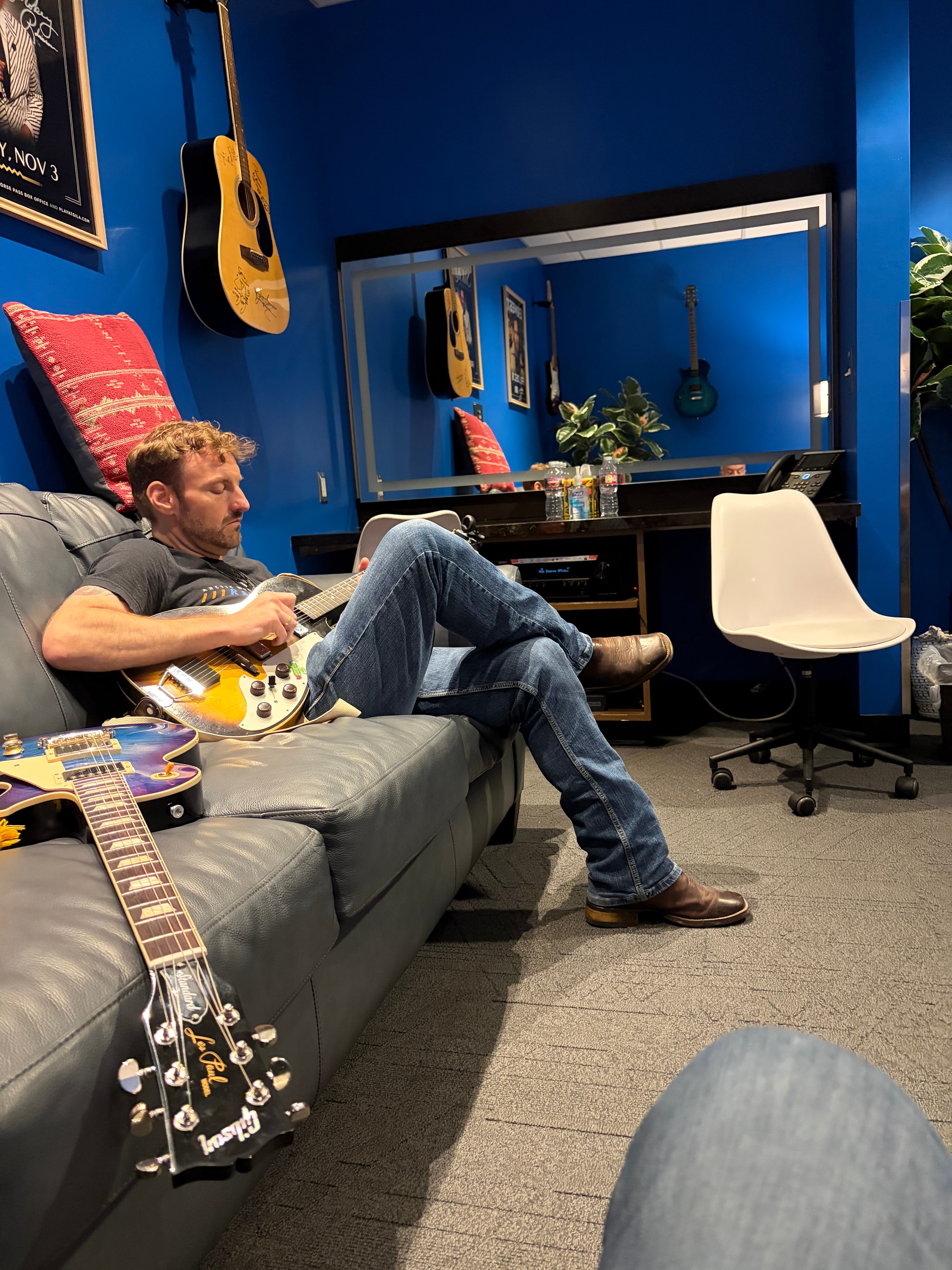 Musician relaxing with electric guitar