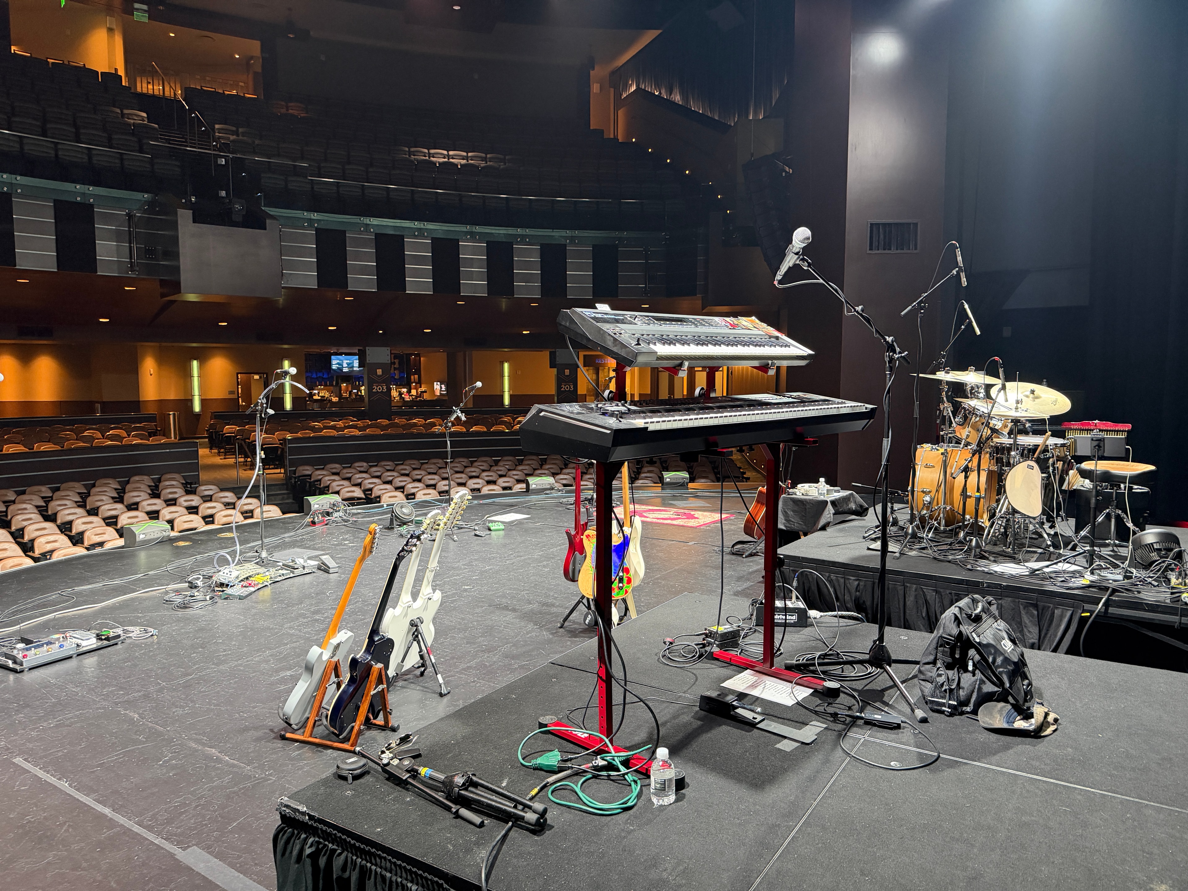 Concert stage setup with instruments and equipment